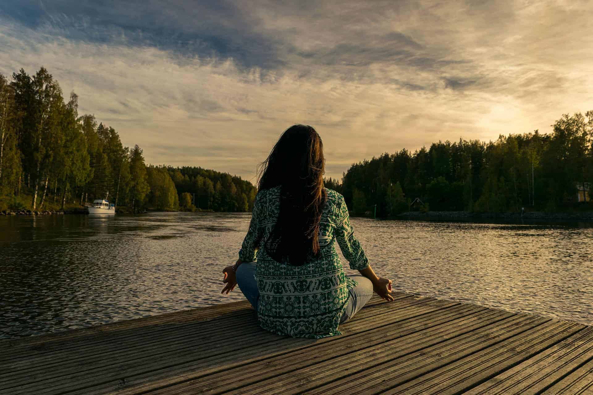 fasting meditation over lake sunrise